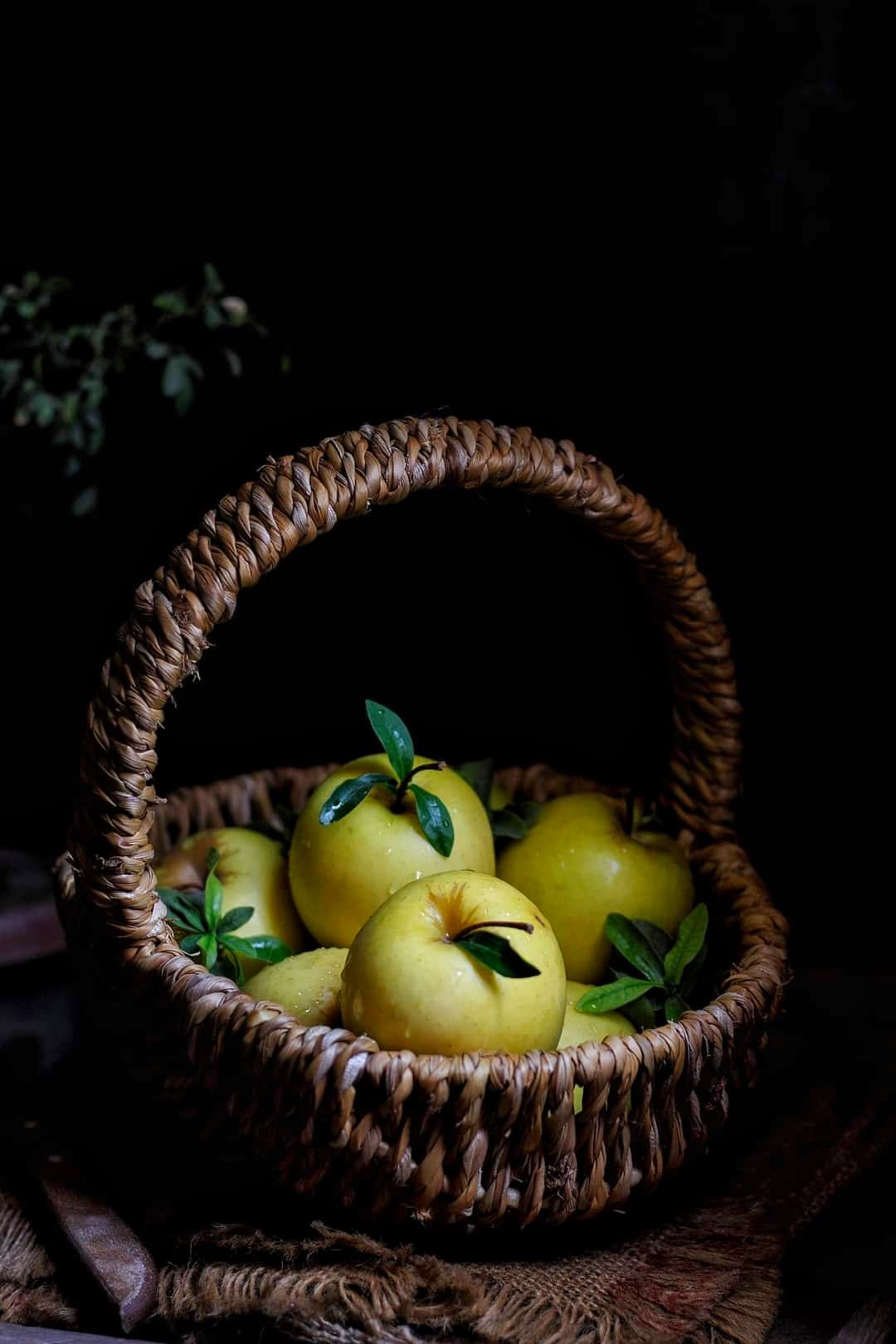 Straw basket with apples